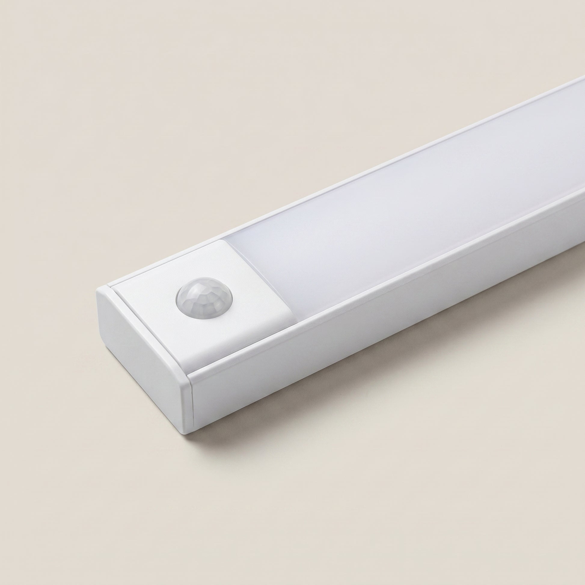 Front detail close-up of aluminum silver linear motion sensor rechargeable under cabinet light showing slim profile and button control in silver finish