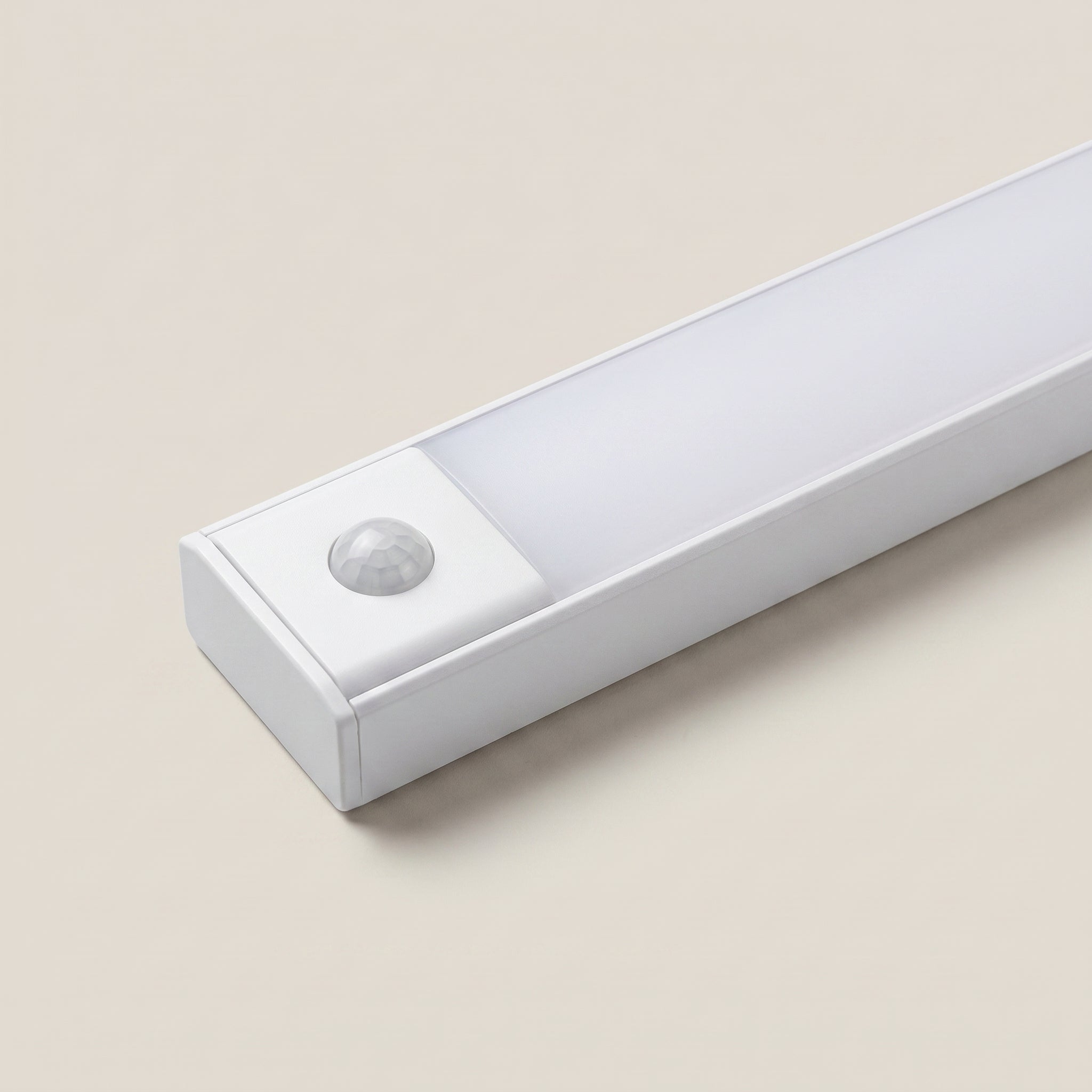 Front detail close-up of aluminum silver linear motion sensor rechargeable under cabinet light showing slim profile and button control in silver finish