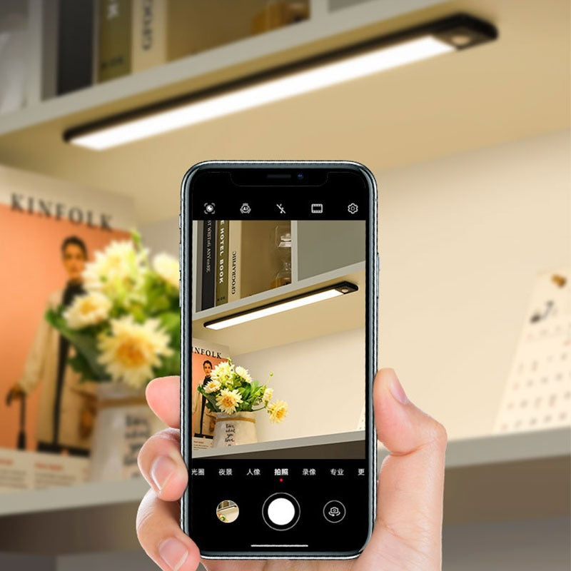 Side profile of aluminum silver linear motion sensor rechargeable under cabinet light unlit against studio background in silver finish