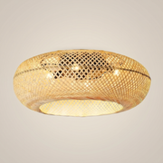 Style A bamboo oval remote control ceiling fan light shown at three-quarter angle with natural bamboo weave plastic blades and semi-flush canopy