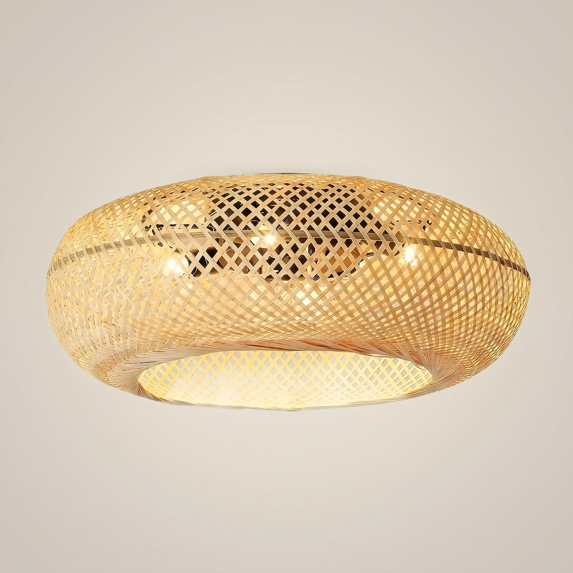 Style A bamboo oval remote control ceiling fan light shown at three-quarter angle with natural bamboo weave plastic blades and semi-flush canopy