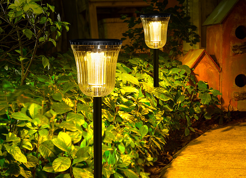 Side profile of black ABS PC round solar panel dual color temperature LED garden path light with slide switch visible