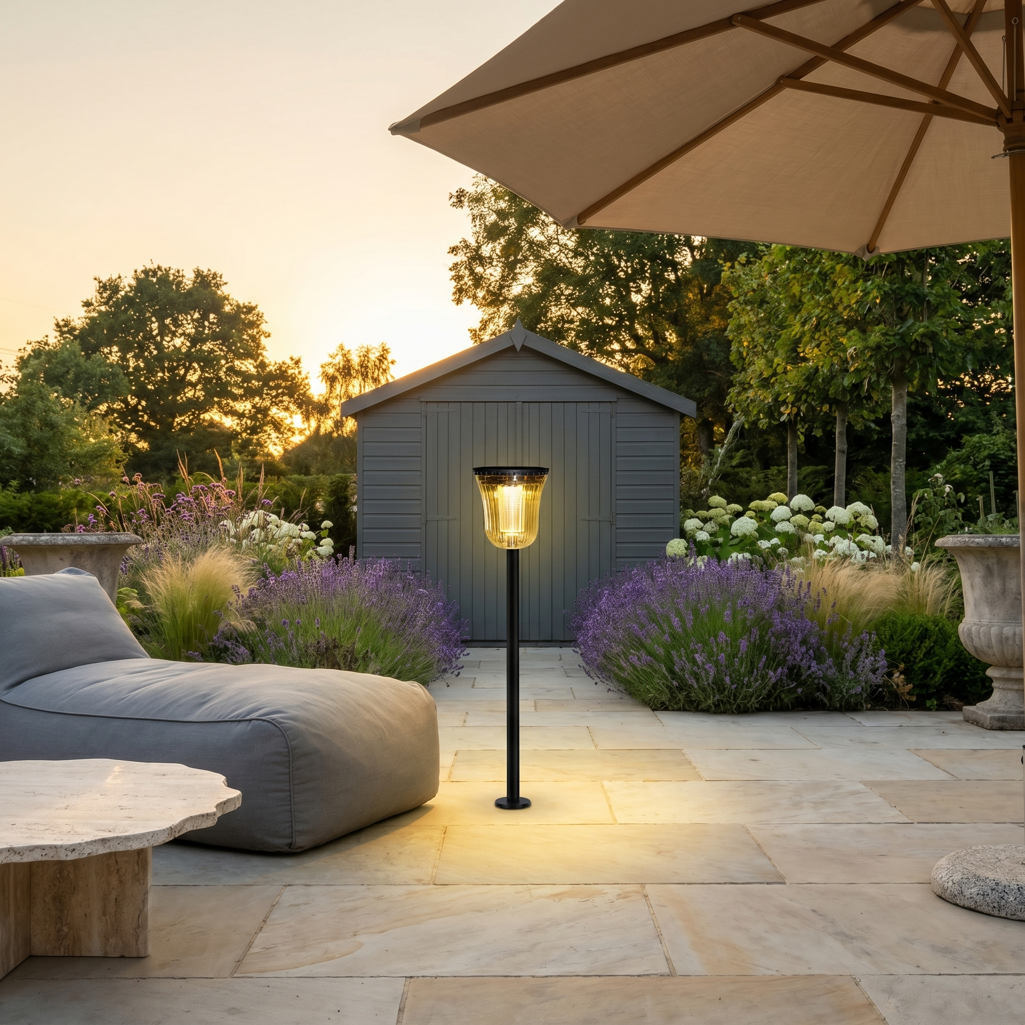 Black ABS PC round solar panel dual color temperature LED garden path light three-quarter view on pathway at dusk lit