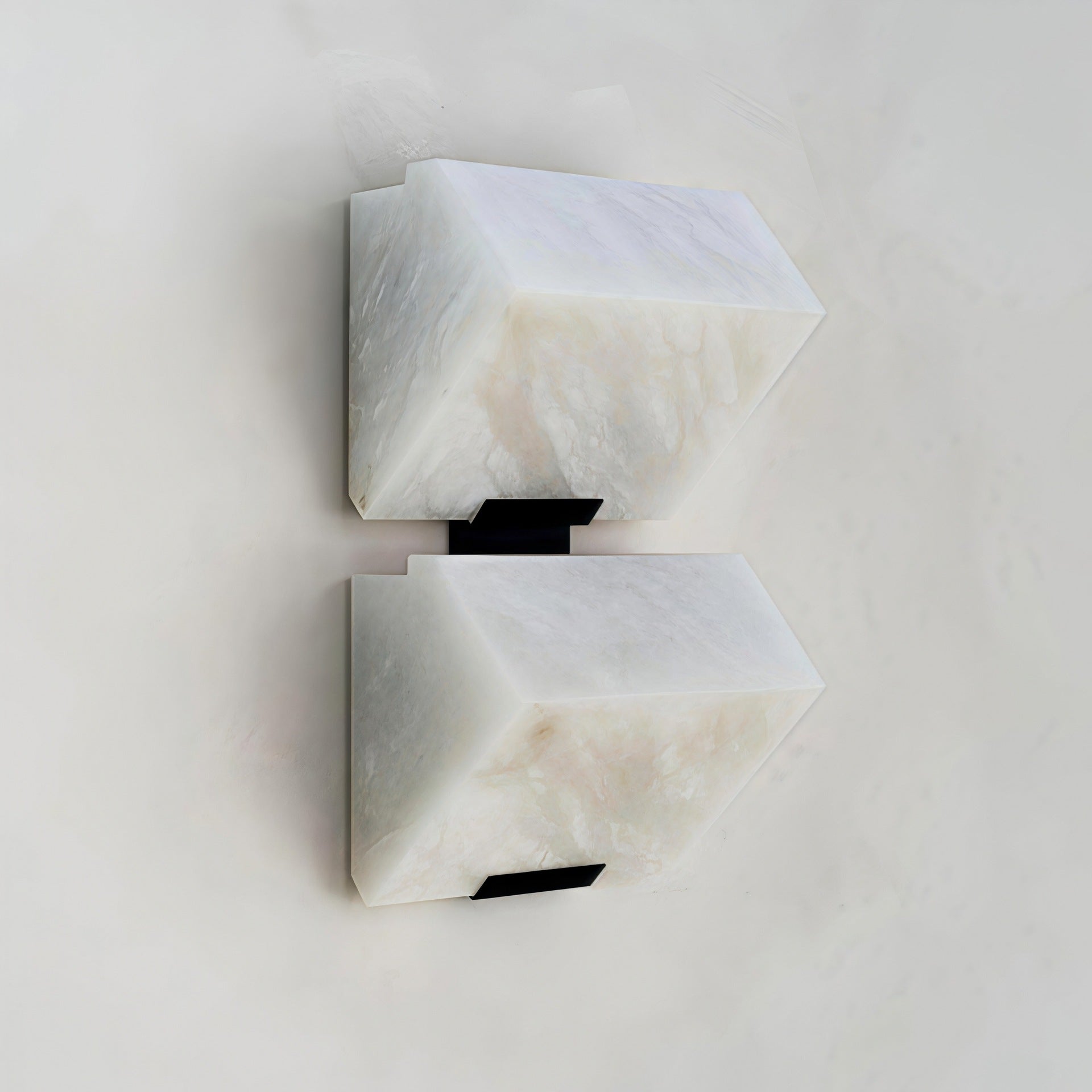 Side profile of black faux marble resin single-head LED wall sconce unlit showing black iron body and natural faux marble resin shade