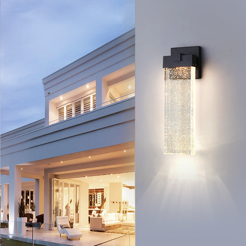 Front view of small size black matte die-cast aluminum crystal COB LED outdoor wall sconce with crystal shade and warm white light