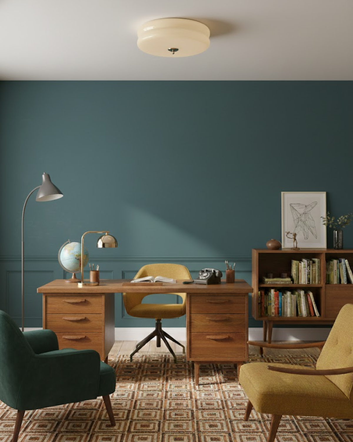 Époque glass pendant lamp with brass finish in a stylish home office with a teal wall, a wooden desk, a yellow office chair, and a bookshelf.