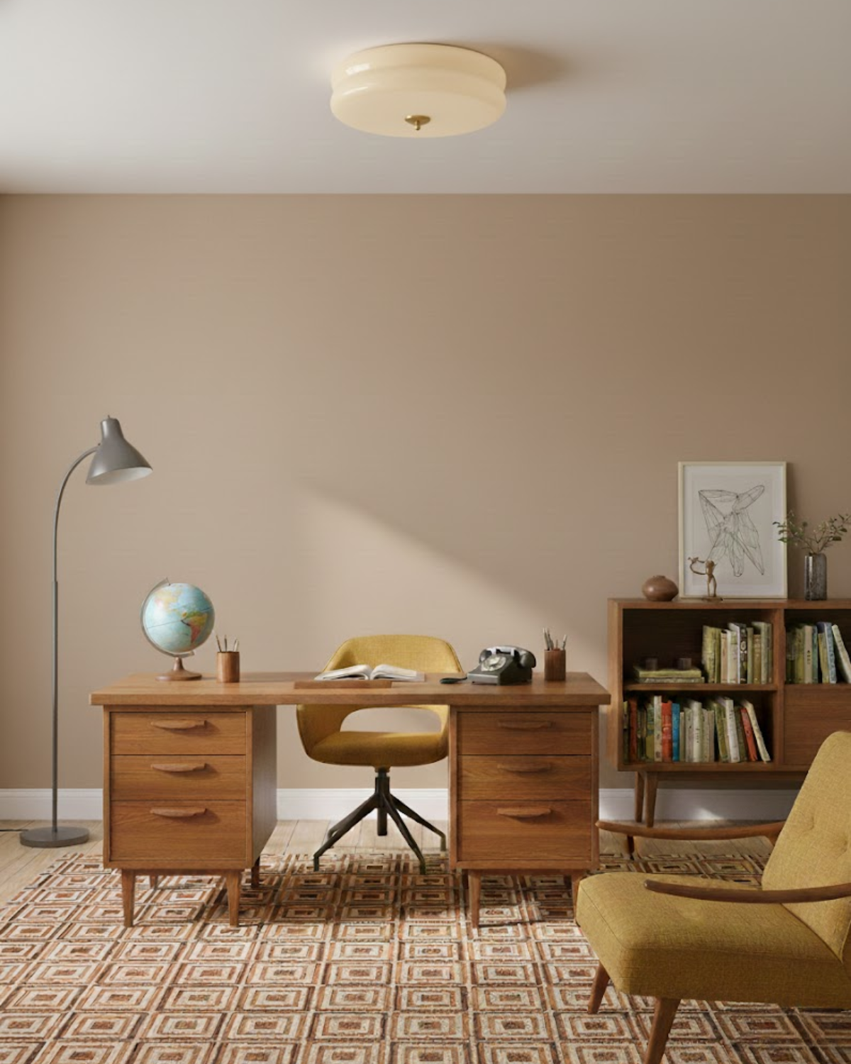 Époque glass pendant lamp with brass finish in a mid-century modern home office featuring a wooden desk, yellow swivel chair, and a bookshelf.