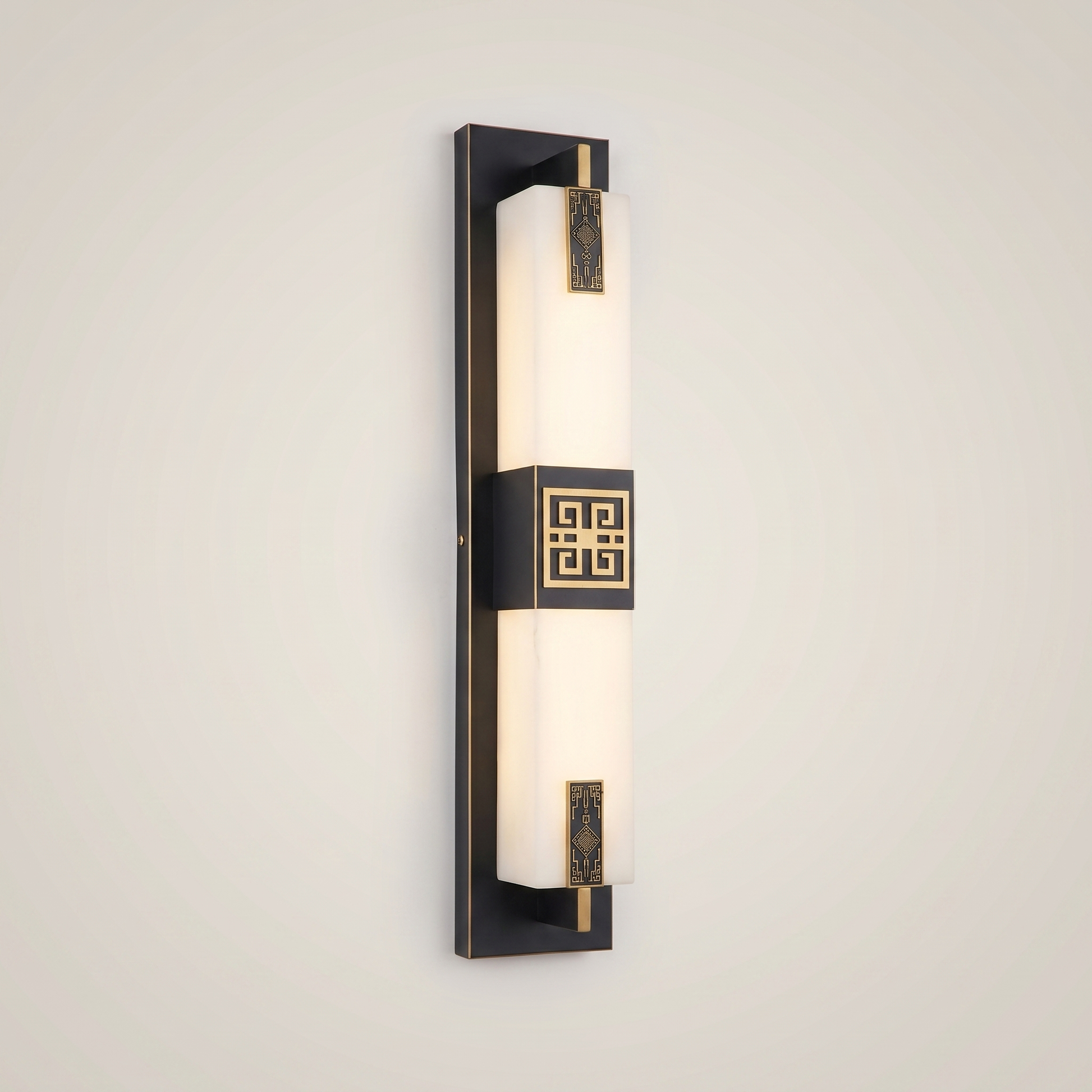 Close-up of elongated gold outdoor water-resistant wall sconce Jingyi 4.7 inch by 23.5 inch lit showing material texture