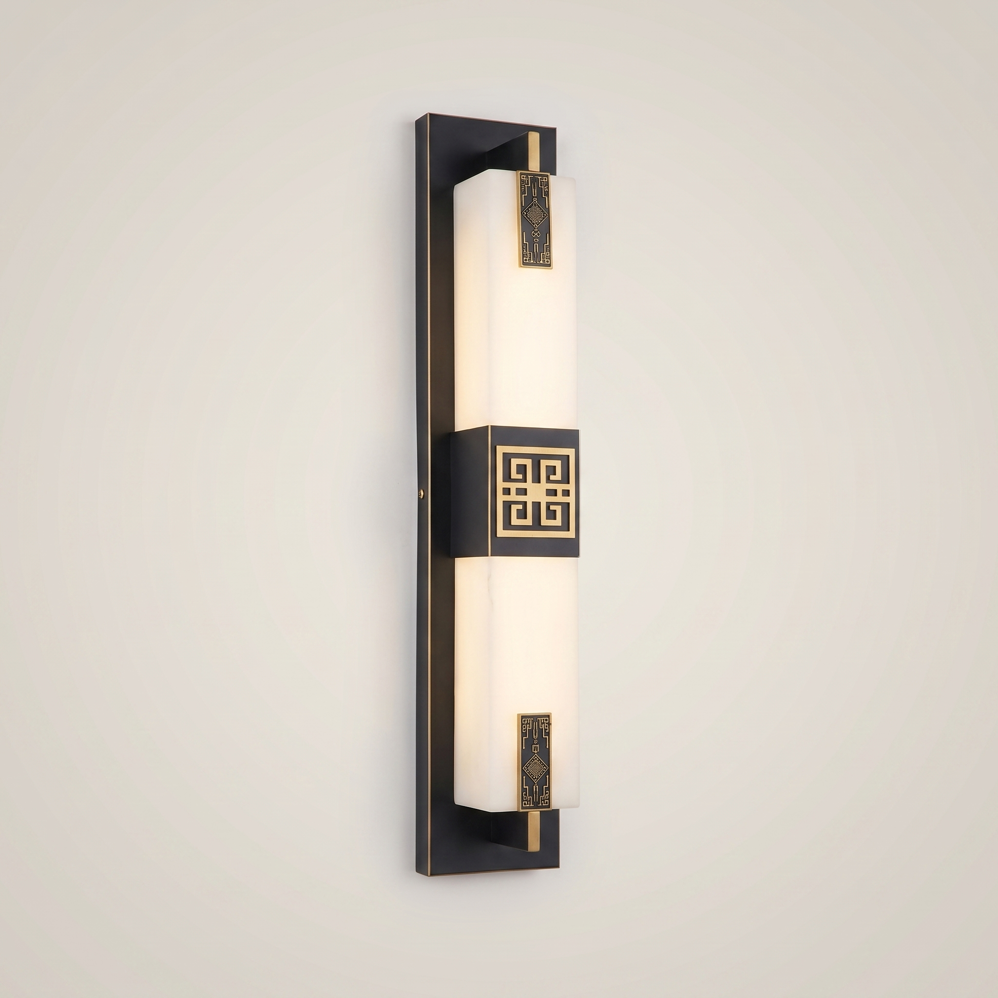 Close-up of elongated gold outdoor water-resistant wall sconce Jingyi 4.7 inch by 23.5 inch lit showing material texture