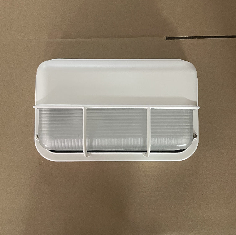 Fenwick vintage outdoor glass sconce wall lamp, Model A white variant, featuring a rectangular white metal frame and clear ribbed glass, unlit and displayed against a brown background.