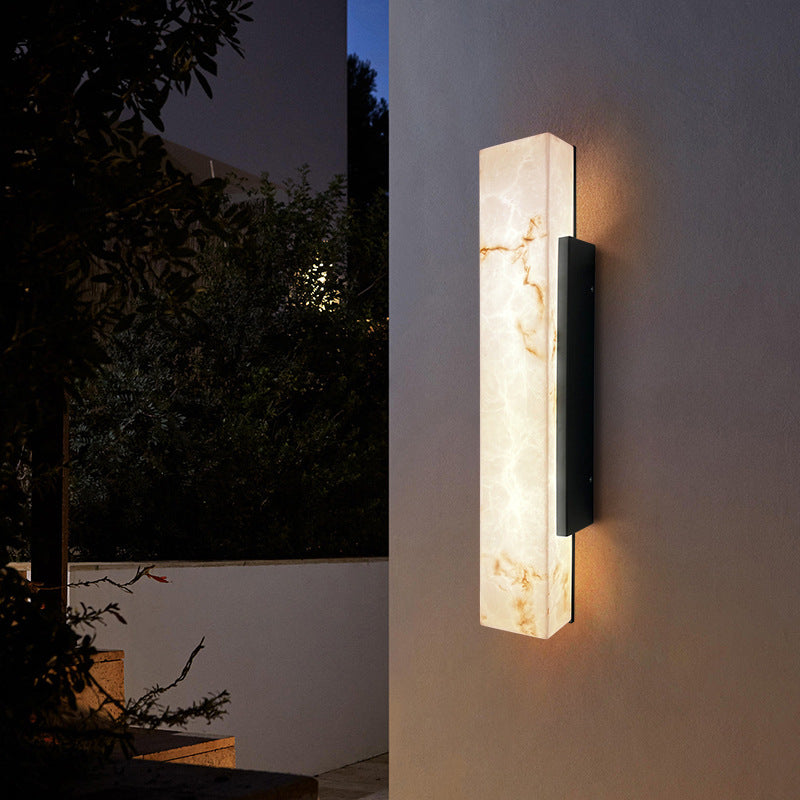 Front view of imitation cloud stone rectangular waterproof LED outdoor wall sconce variant 5.1 inch wide by 15.7 inch high with black mounting bracket