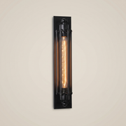 Iron antique brass multi-head LED wall sconce shown front view with warm light highlighting retro style