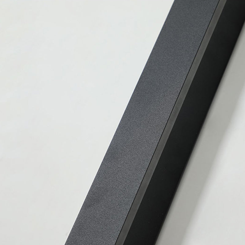 Close-up view of the black metal textured finish of the Luna Edge IP65 linear LED wall light, showing the durable exterior when the light is off.