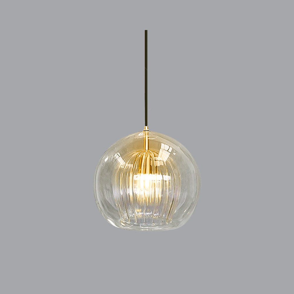 A single Lustre Aura LED pendant light in clear glass, showcasing its ribbed inner diffuser and warm light glow against a simple gray background, emphasizing its modern design.