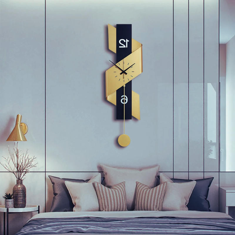 Large Metal Wall Clock With Noiseless Modern Pendulum on a blue wall.