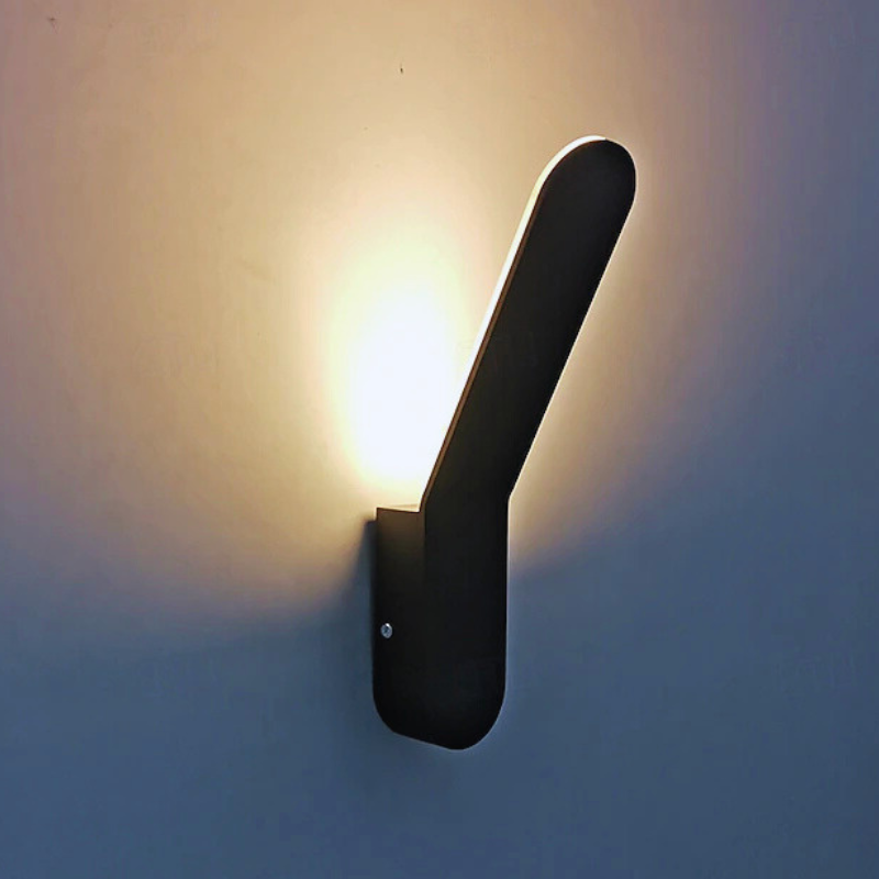 Modern Minimalist Nordic Wall Light Sconce lighting a white wall.