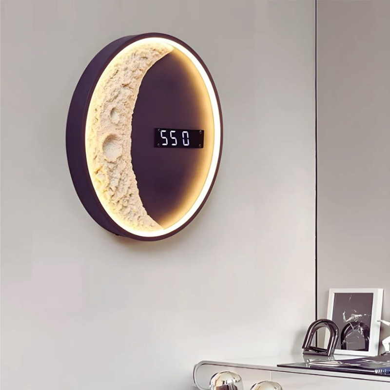 Moon LED Wall Light with Digital Wall Clock moon-shaped above a table.
