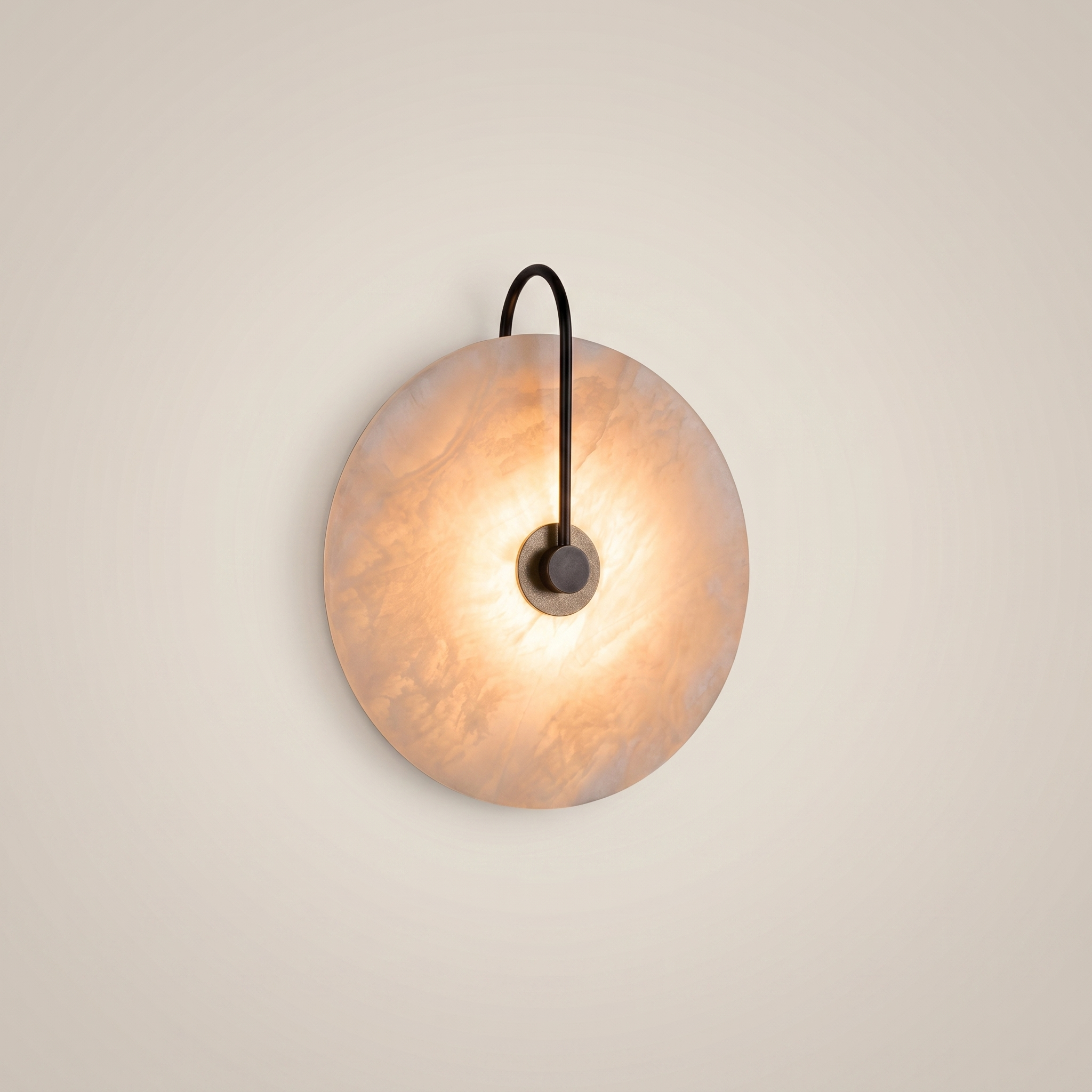 Natural marble black round warm LED wall sconce shown front view with 20cm diameter and warm light glowing