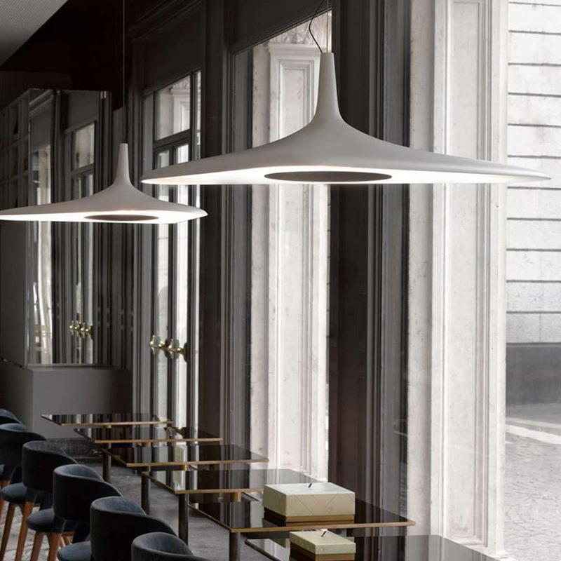 Nordic Art Pendant Light in black at three-quarter angle showing tri-color LED lit and resin glass detail