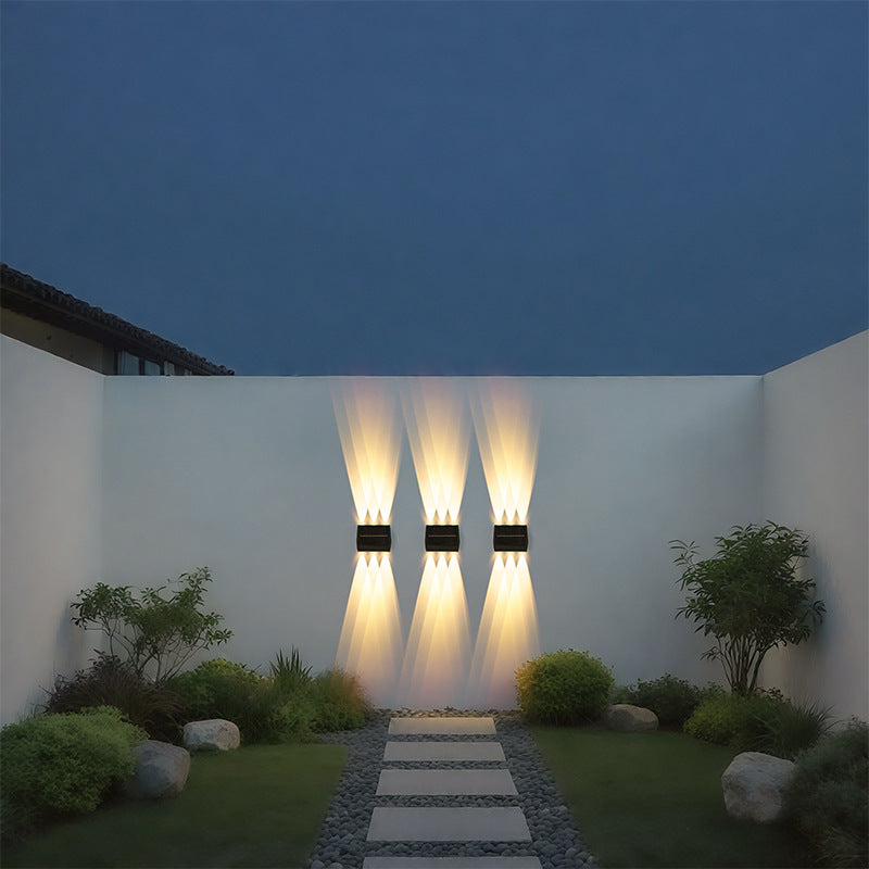 Close-up showing IP55 sealed stainless steel aluminum housing of 2-head solar motion sensor outdoor wall sconce