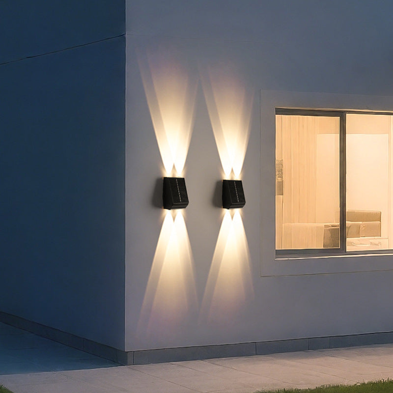 Side profile of warm white light stainless steel aluminum 2-head solar motion sensor wall sconce with motion sensor visible