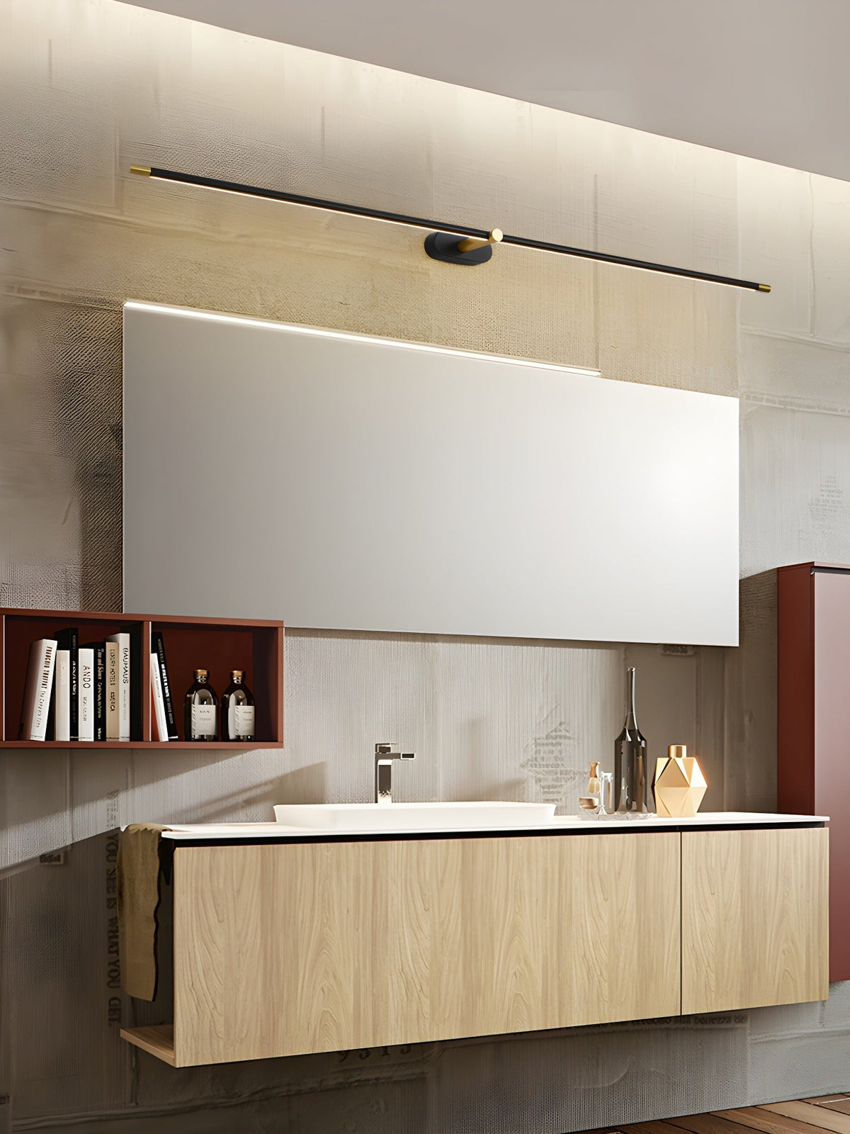 Vestra Minimalist Linear Rechargeable Wall Lamp in black, mounted above a rectangular mirror and wooden vanity in a modern bathroom. The lamp emits a warm LED glow.