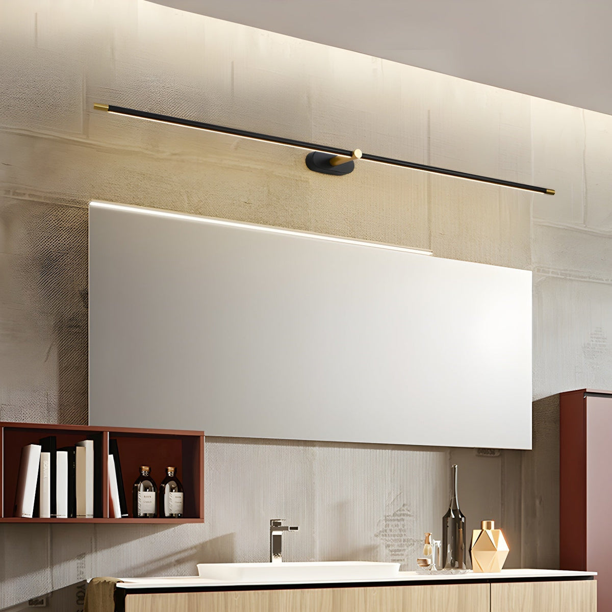 Vestra Minimalist Linear Rechargeable Wall Lamp in black with gold accents, illuminated, mounted above a rectangular mirror in a modern bathroom setting, showcasing its use as a vanity light.