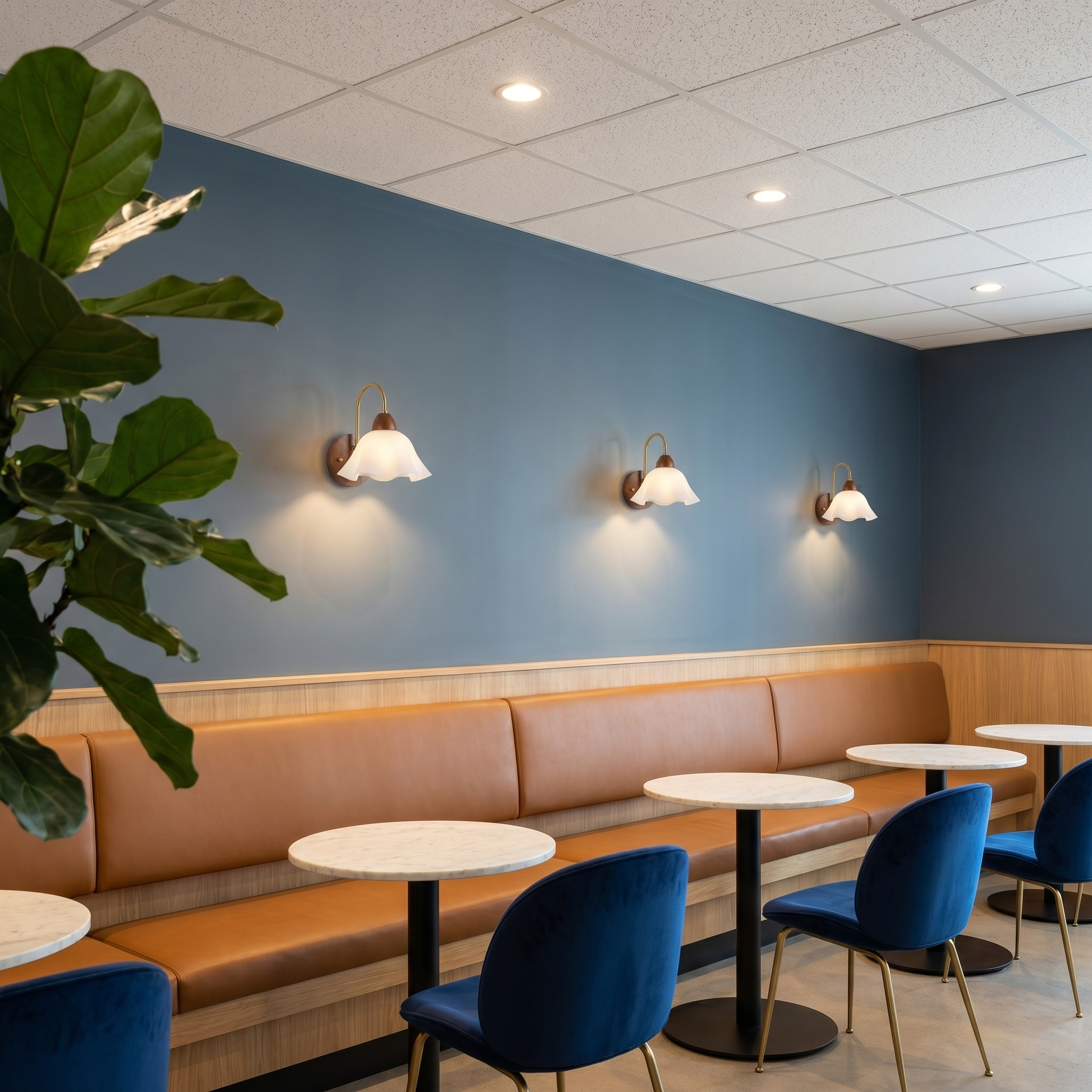 Walnut wood single-head mid-century wall sconce shown in ambient room lighting with walnut finish on sitting room wall