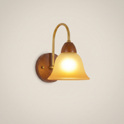 Walnut wood single-head mid-century wall sconce shown front view with walnut finish mounted on bedroom wall at position zero