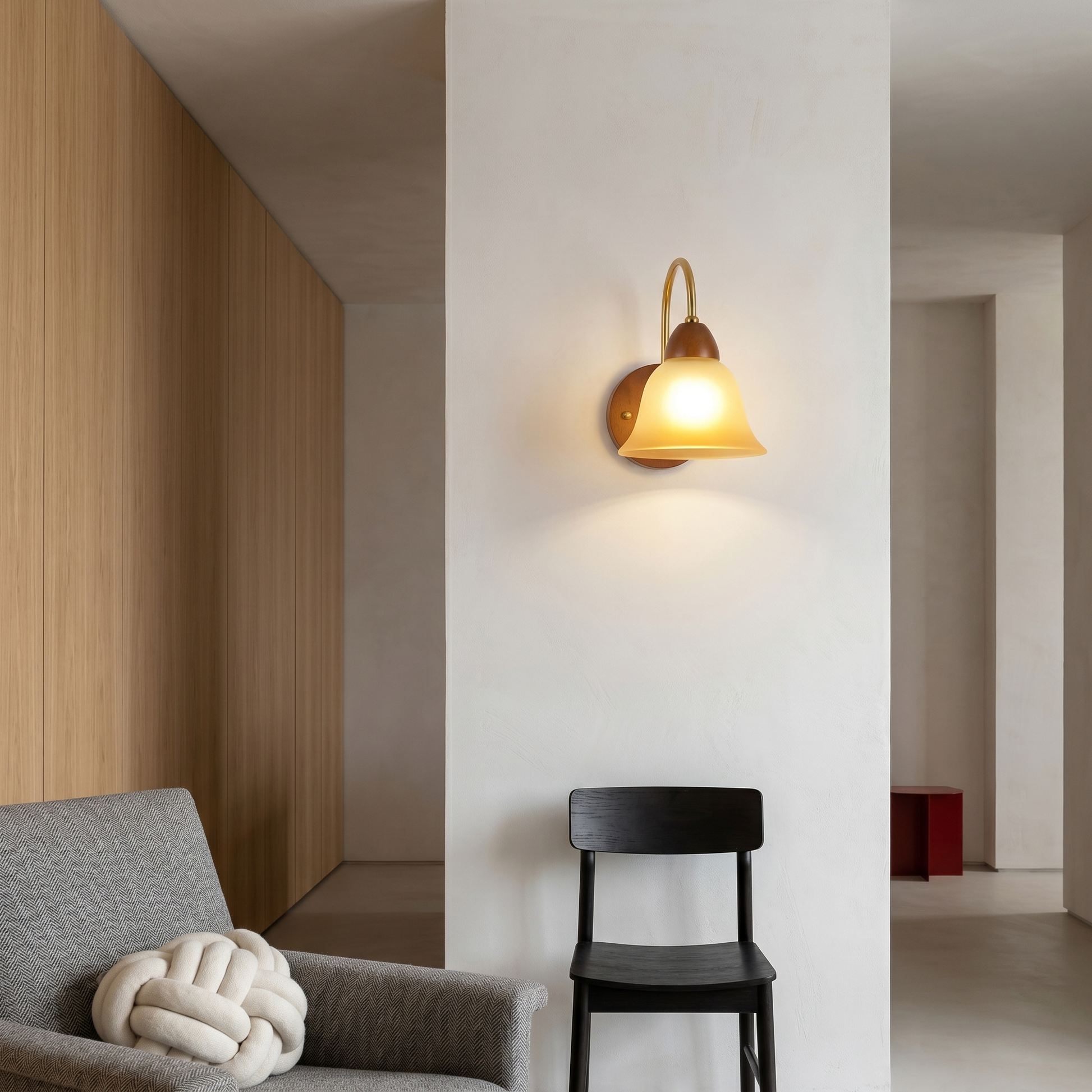 Walnut wood single-head mid-century wall sconce shown at three-quarter angle with walnut finish on living room wall