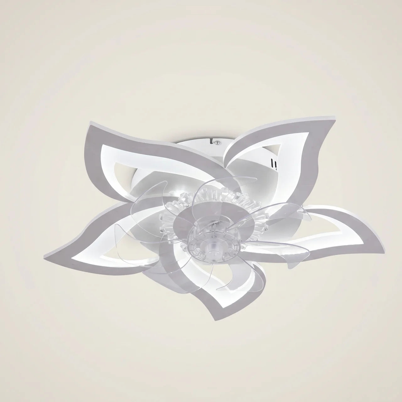 White Kazetsu model 19.3 inch wide ceiling fan light eye-level wide lifestyle sofa side scene with flush mount and integrated LED ring