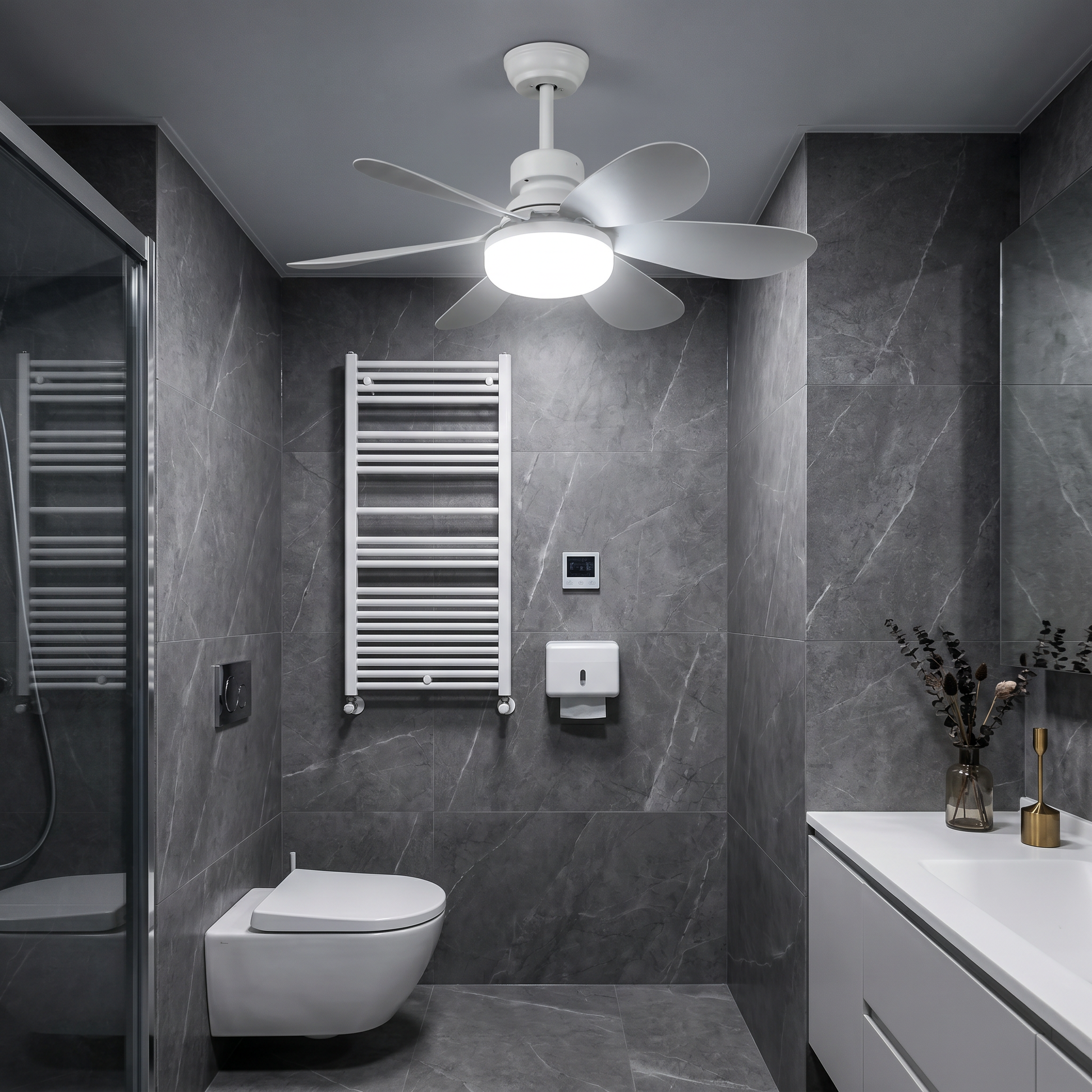 Top-down view of white plastic round DC brushless motor ceiling fan light with white blades lit in an ambient bathroom