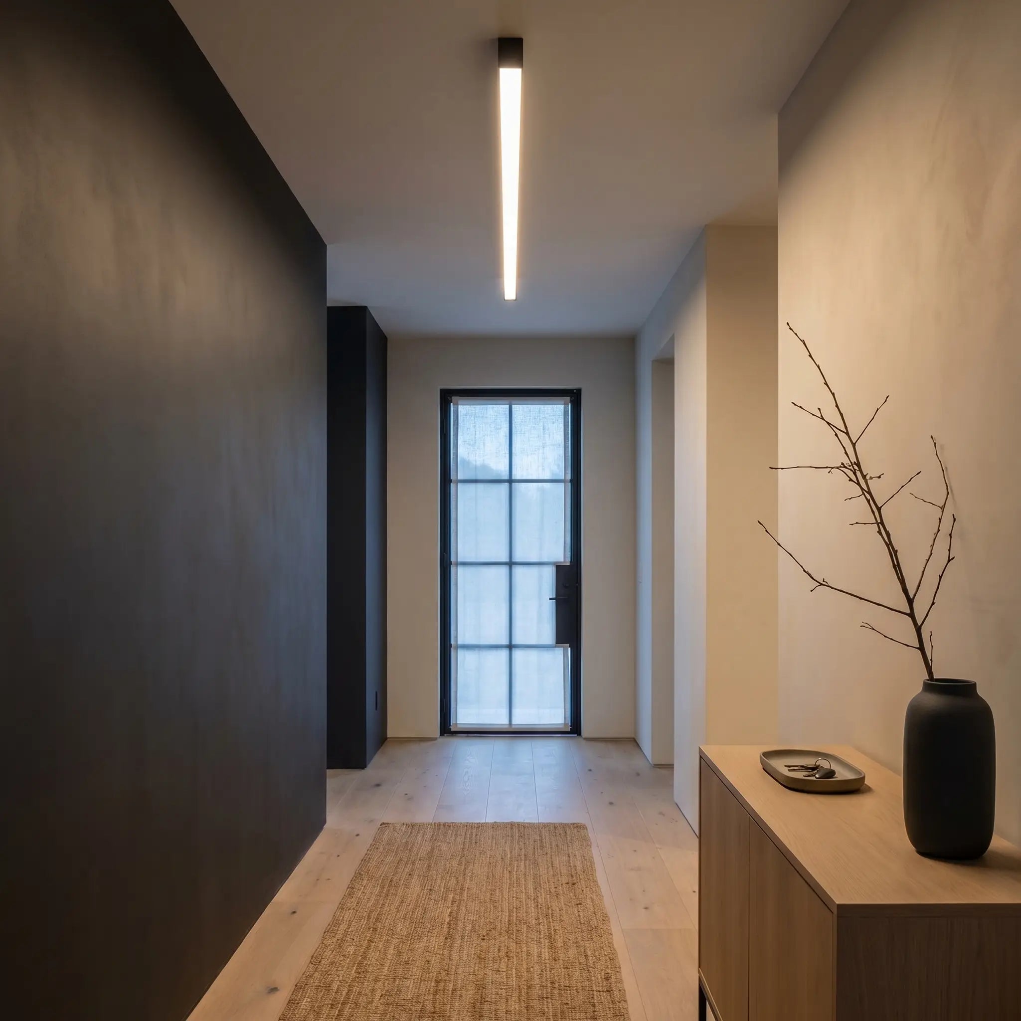 Close-up of modern minimalist aluminum sand white ceiling light off linear strip showing remote control and material detail