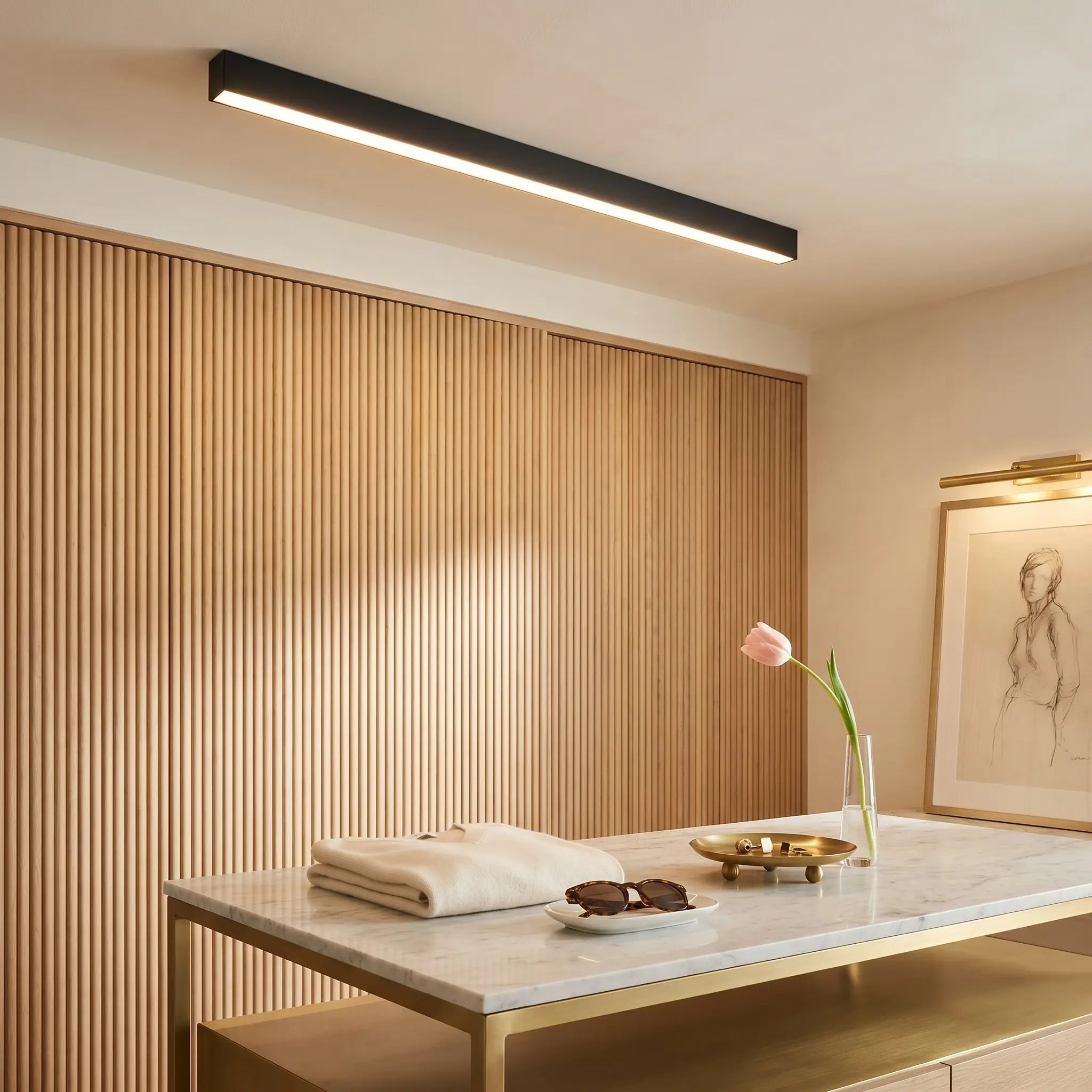 Ambient room view of modern minimalist aluminum sand white ceiling light dimmed linear strip with remote control visible