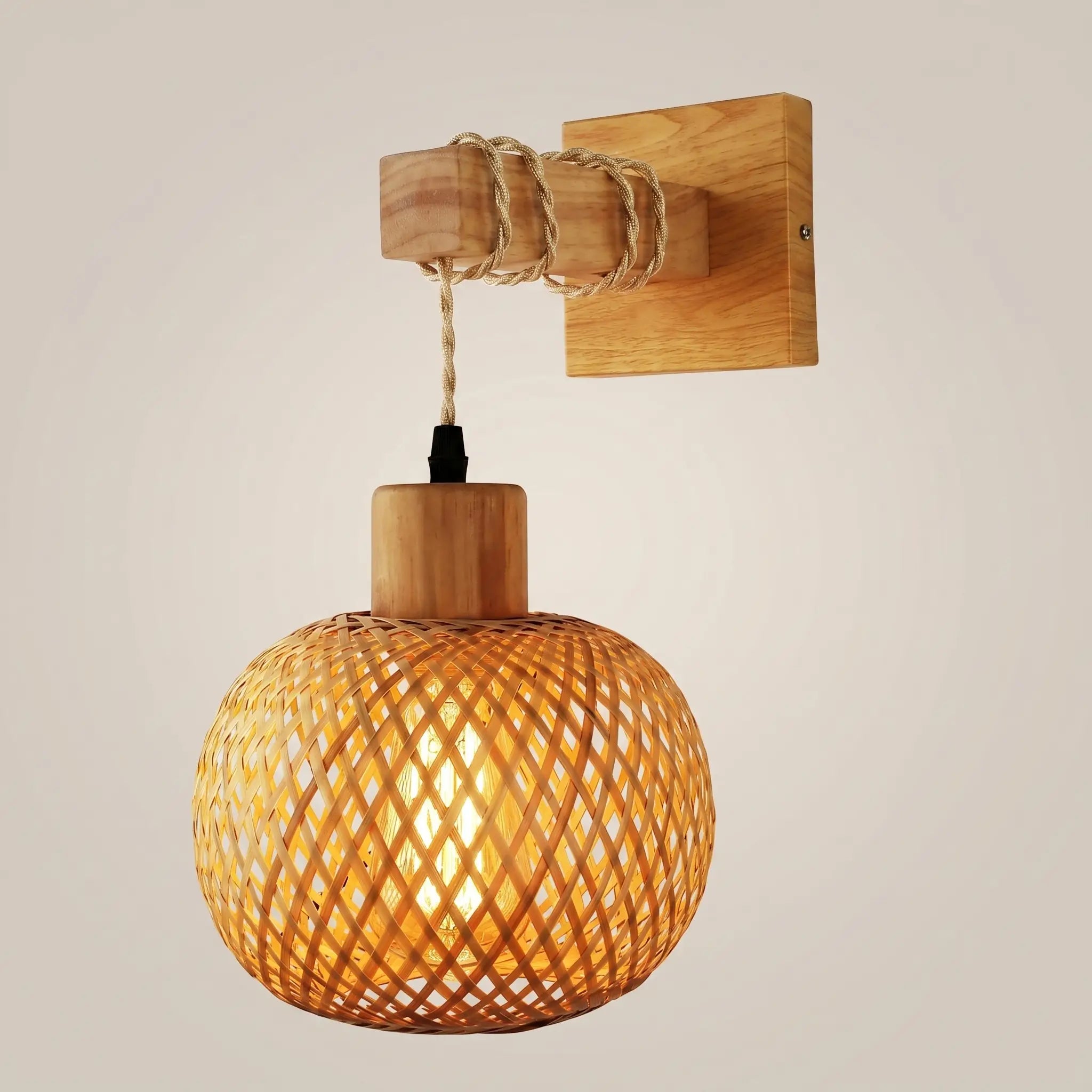 Pastoral bamboo wood spherical incandescent ceiling light front view with warm glow on natural wood frame and woven bamboo shade lit